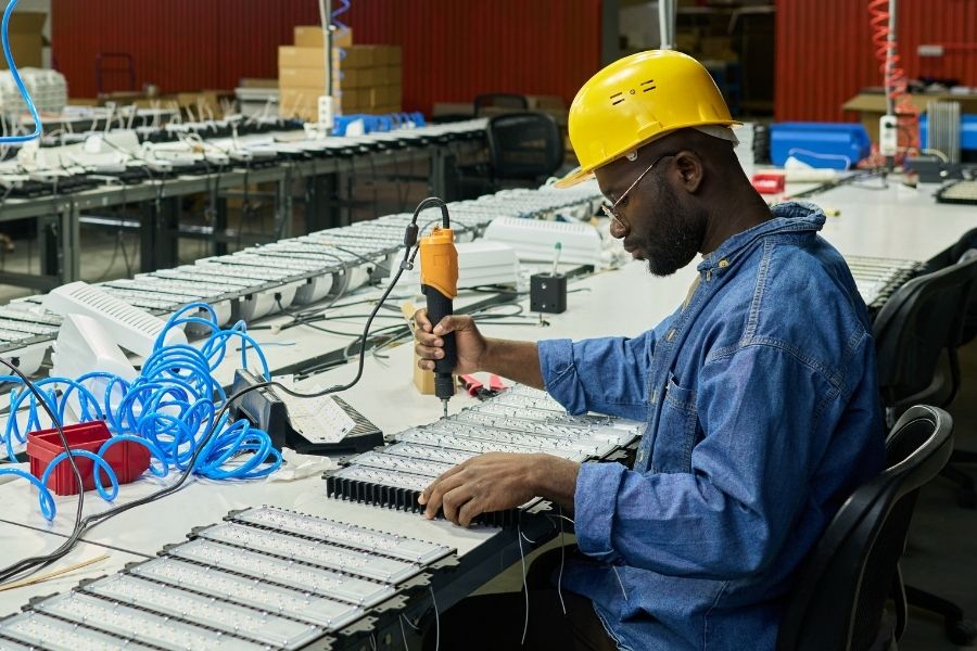 Automotive experience man using tool in warehouse 