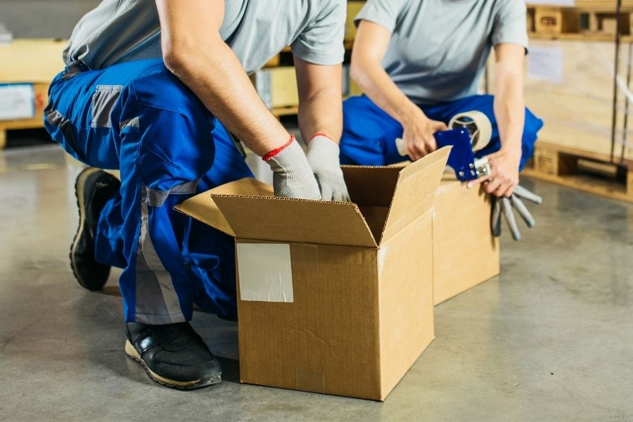 hand packing box in warehouse