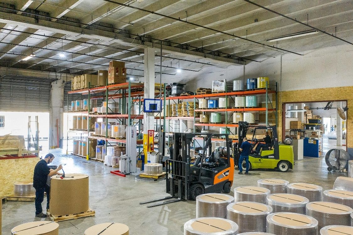 third party Logistics Support For Demanding Sectors - logistics warehouse filled with a variety of products from different sectors such as automotive