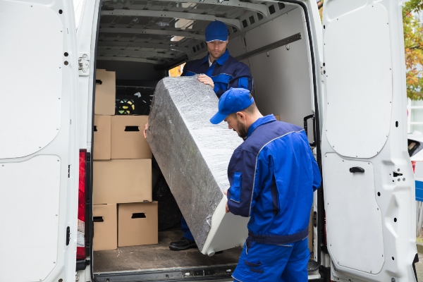 ecommerce Warehousing Logistics Management Systems - Scanning device being operated by a warehouse worker Infront of stock racking
